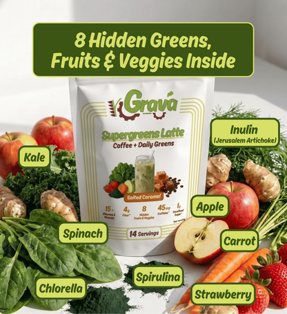 A bag of Grava Supergreens Latte coffee with daily greens is centered on a white surface, surrounded by labeled produce and greens including kale, spinach, chlorella, spirulina, apple, carrot, strawberry, and inulin. A green banner at the top reads '8 Hidden Greens, Fruits & Veggies Inside'.